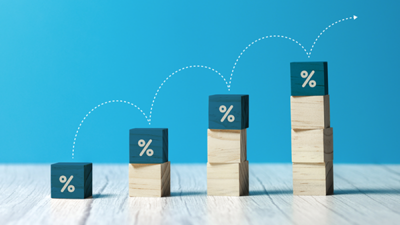 Success represented by jumping up a bar graph